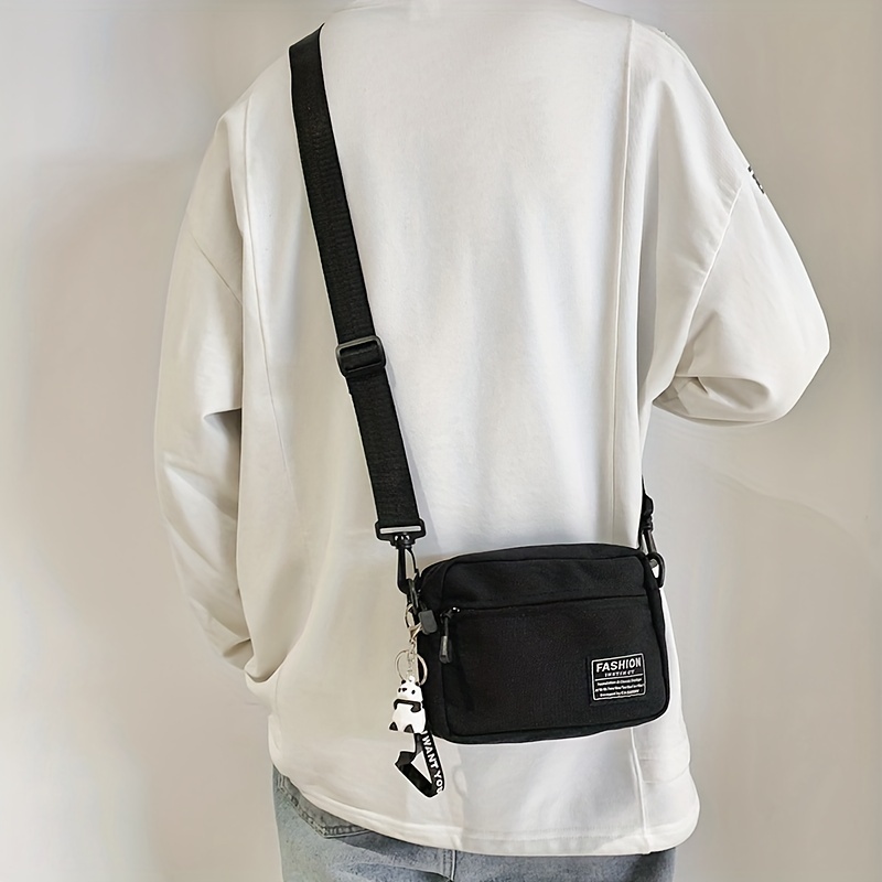 mens fashion casual canvas messenger bag with pendant details 0