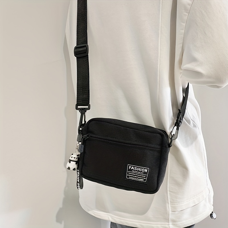 mens fashion casual canvas messenger bag with pendant details 1